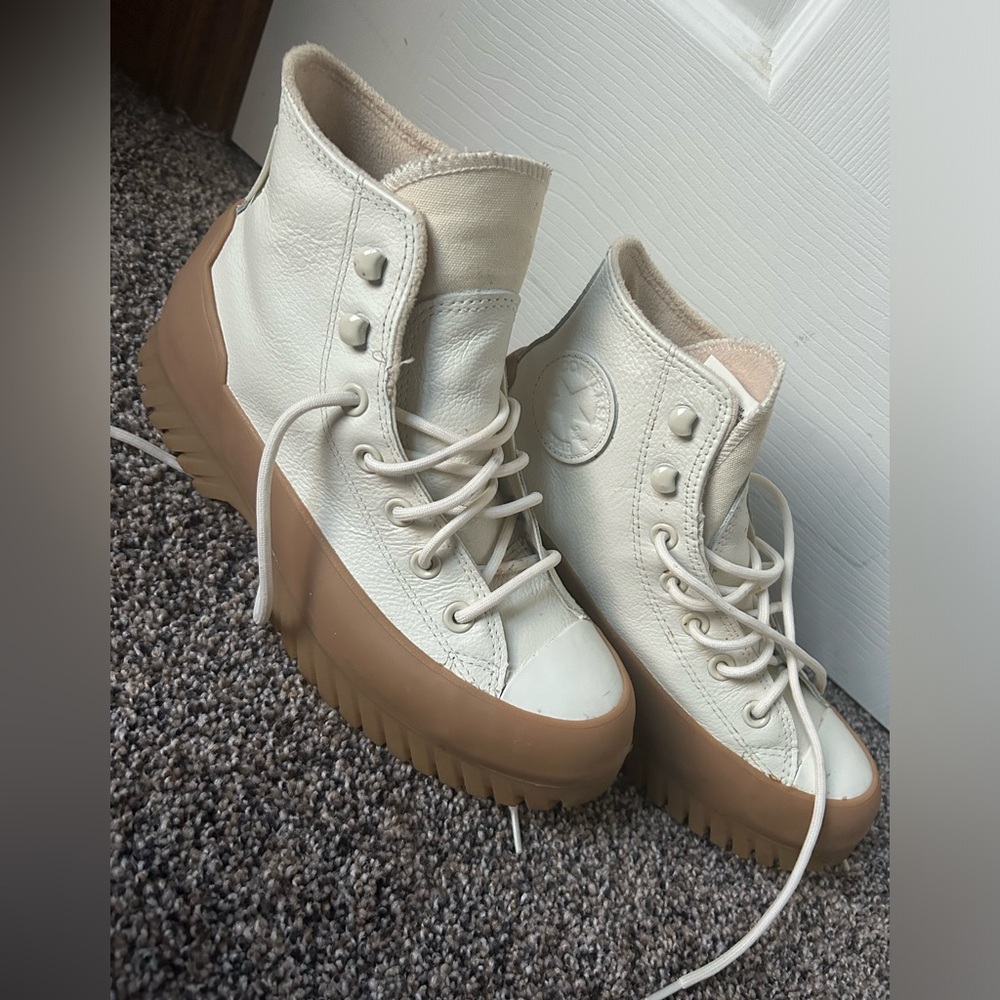 Woman’s high top Converse leather shoes